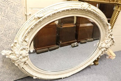 Lot 3096 - A Victorian Style Bevelled Glass Mirror, modern, the oval plate within a cream crackle painted...