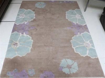 Lot 3111 - A Modern Machine Made Harem Rug, designed by Tamsin de Romeur,  decorated with stylised flowers...
