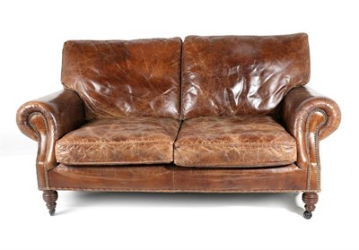 Lot 3116 - A Two-Seater Sofa, Labelled Halo&nbsp;modern, upholstered in vintage close-nailed brown...