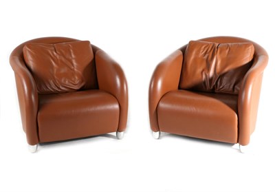 Lot 3120 - A Pair of Italian Brown Leather Tub Shaped Armchairs, labelled Moroso, modern, with curved back...