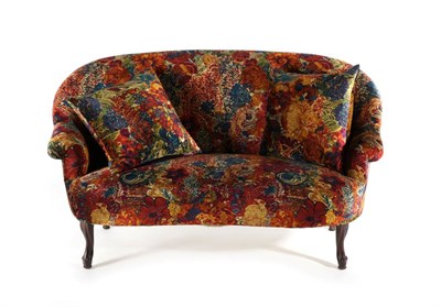 Lot 3135 - A Victorian Sofa, late 19th century, recovered in Liberty floral patterned fabric, with curved back
