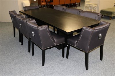 Lot 3141 - A Black Ash Dining Table, modern, raised on a rectangular base, 250cm by 100cm by 75cm; and A...