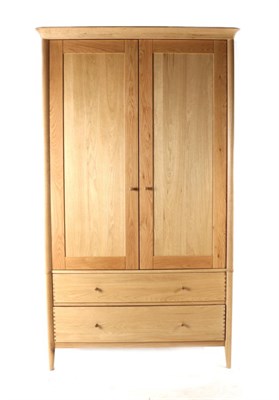 Lot 3145 - A John Lewis Essence Oak Two Door Wardrobe, of recent date, the moulded cornice above two...