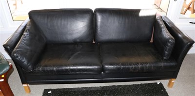 Lot 3172 - A 1970s Danish Design Two-Seater Sofa, upholstered in black leather with six cushions and...