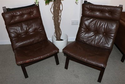 Lot 3176 - A Pair of Brown Leather and Formed Laminate Chairs, by Farstrup, with curved frames and...