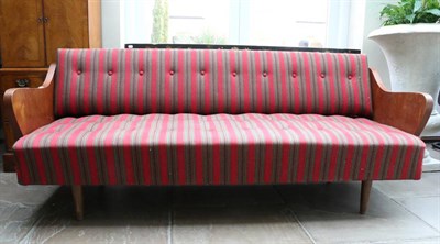 Lot 3180 - A 1950s Danish Design Teak Frame Day Bed, recovered in red and green buttoned striped fabric, 195cm