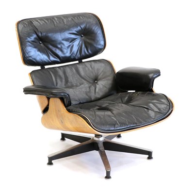 Lot 3189 - Charles and Ray Eames: A Brazilian Rosewood Lounge Chair, 1960s, the black leather padded...