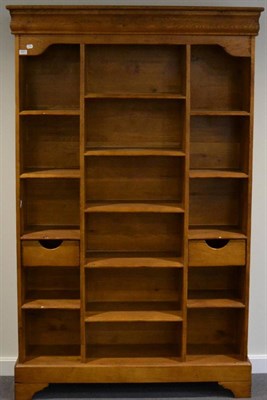 Lot 3001 - A Reproduction Oak Bookcase, the plain cornice above an arrangement of shelves, two small...