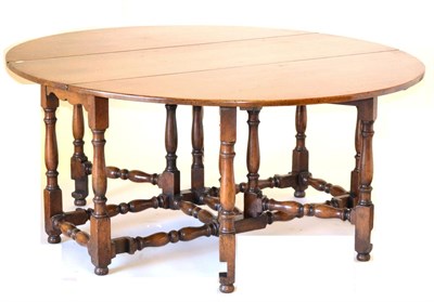 Lot 3005 - A Reproduction Oak Six-to-Eight Seater Double Gateleg Table, with two rounded drop leaves to...