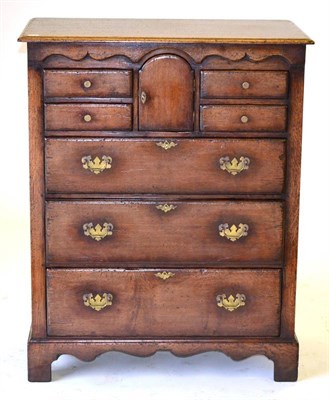 Lot 3014 - A Titchmarsh & Goodwin Reproduction Oak Straight Front Chest of Drawers, with central arched...