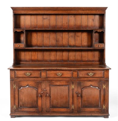 Lot 3015 - A Titchmarsh & Goodwin Oak Dresser, the rack with two fixed shelves, open niches and two small...