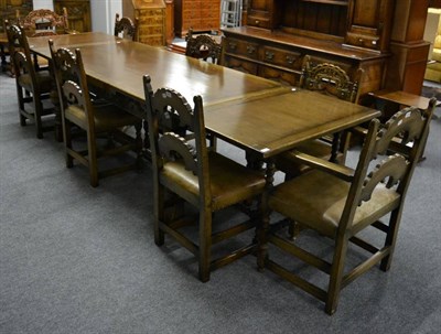 Lot 3020 - A Reproduction Oak Drawleaf Dining Table, in 17th century style, with a carved frieze above...