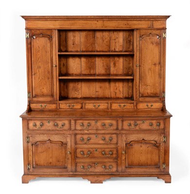 Lot 3032 - A Reproduction Oak Dresser and Rack, in George III style, the upper section with two shelves...
