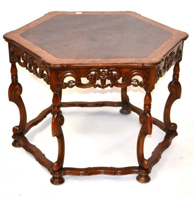 Lot 3046 - A Reproduction Burr Walnut Hexagonal Shaped Coffee Table, the crossbanded top above a scrolled...