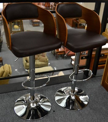 Lot 3086 - A Pair of Reproduction Oak, Brown Leather and Polished Chrome Bar Stools, with curved back supports