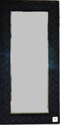 Lot 3107 - A Reproduction Mirror, of large proportions, the frame upholstered in black buttoned velvet,...