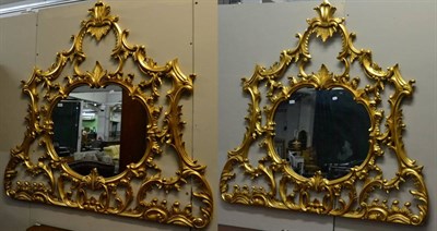 Lot 3119 - A Pair of Gilt Mirrors, of recent date, the circular plates framed with C scrolls and headed by...