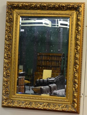 Lot 3123 - A Reproduction Gilt Framed Bevelled Glass Mirror, in Victorian style, with an acanthus...