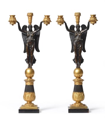 Lot 793 - A Pair of French Empire Gilt Bronze Winged Angel Two-Branch Three-Light Table Candelabra, upon...