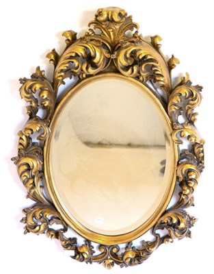 Lot 3125 - A Gilt Composition Mirror, of recent date, with oval bevelled glass within an acanthus rococo style