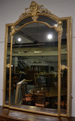 Lot 3133 - A Louis XV Style Gilt and Gesso Mirror, with a moulded flower decorated frame surmounted by a C...