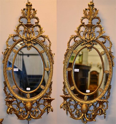 Lot 3138 - A Pair of Gilt Two-Branch Girandoles, of recent date, with oval plates and two candle arms...