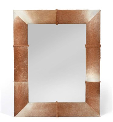 Lot 3140 - A Reproduction Rectangular Wall Mirror, with brown and white cow hide frame, 103cm by 80cm See...