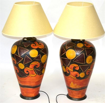 Lot 3144 - A Pair of Isnik Style Table Lamps, of recent date, of vase shaped form, decorated in orange and...