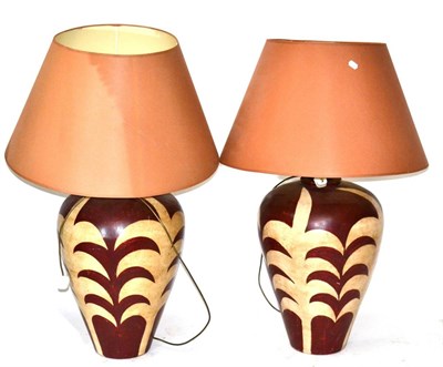 Lot 3145 - A Pair of African Camouflage Style Ceramic Table Lamps, printed in red and cream with vase...