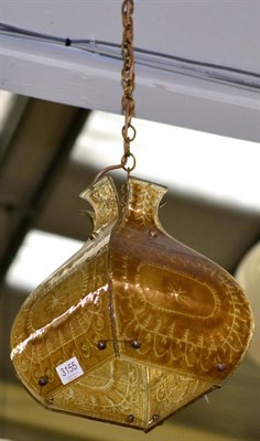 Lot 3155 - A 1970s Amber Tinted Hanging Light Shade, made up of four panels decorated with geometric...