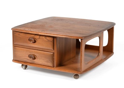 Lot 3158 - An Ercol Light Elm Coffee Table, of rounded square form fitted with two drawers, raised on castors