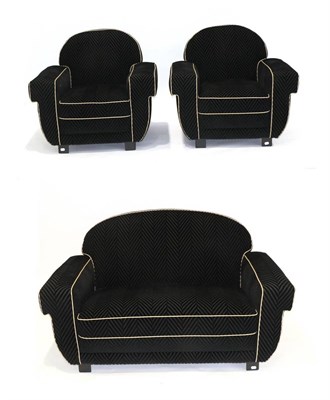 Lot 3161 - An Art Deco Three Piece Lounge Suite, upholstered in black chevron velvet with leather piping,...