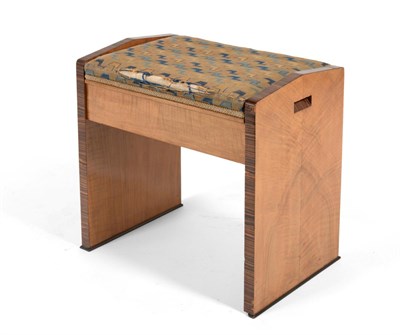 Lot 3163 - An Art Deco Walnut and Rosewood Crossbanded Music Seat, circa 1930, with geometric patterned fabric