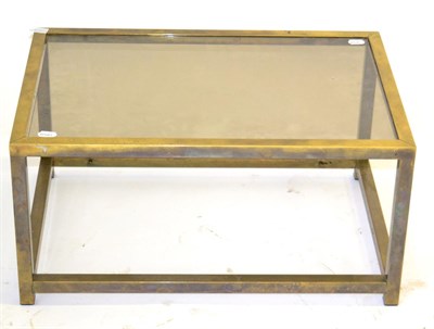 Lot 3171 - A 1970s Brass Rectangular Glass Topped Coffee Table, raised on square form legs joined by a...