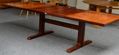 Lot 3173 - A 1970's Danish Skovby Rosewood Extending Dining Table, with two leaves, on shaped supports...