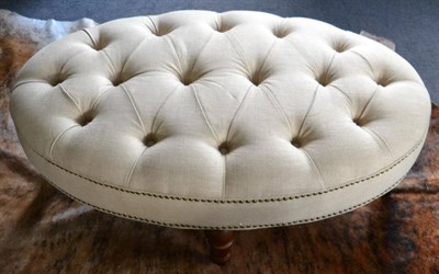 Lot 3182 - An Oversized Foot Stool, of recent date, upholstered in cream overstuffed close-nailed fabric...