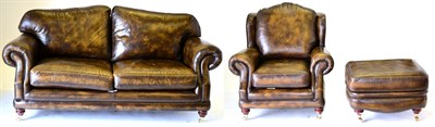 Lot 3188 - A Thomas Lloyd Three Piece Lounge Suite, upholstered in brown close-nailed leather, comprising...