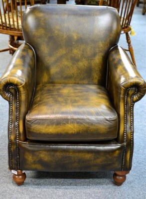 Lot 3189 - A Thomas Lloyd Club Chair, upholstered in close-nailed brown leather with rounded arms and...