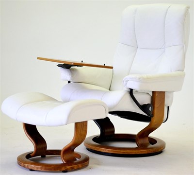 Lot 3191 - A Stressless White Leather Swivel Easy Chair, with pivoting and adjustable tray, raised on an...