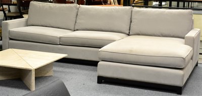 Lot 3193 - A Kraft Upholstery Corner Sofa, circa 2014, in two sections, upholstered in grey cotton felt,...