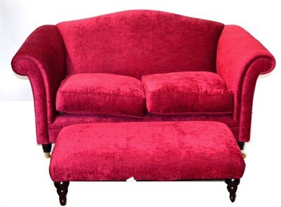 Lot 3202 - A Two Seater Sofa, of recent date, upholstered in red velvet with two squab cushions, raised on...