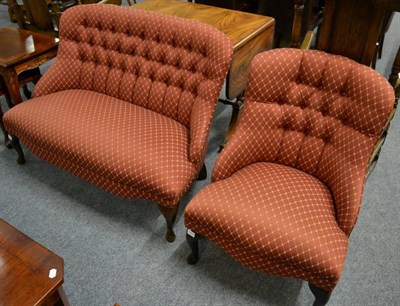 Lot 3204 - A Two-Seater Bedroom Sofa, of recent date, covered in orange buttoned back fabric with...