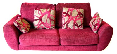 Lot 3209 - A DFS Amanda Model Three-Seater Sofa, upholstered in pink fabric with grey and pink scatter...