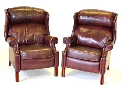 Lot 3212 - A Pair of Ward Brown Close-Nailed Wing-Back Reclining Chairs, with rounded arm supports and...