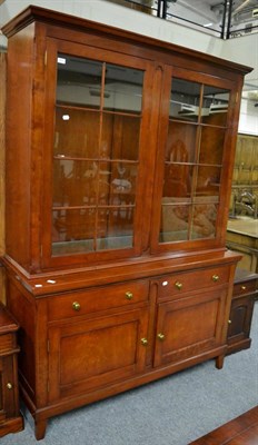 Lot 3223 - An R E H Kennedy Cherrywood Bookcase Model 4039, the upper section with two glazed doors...