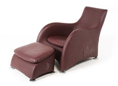 Lot 3241 - A Montis Armchair, upholstered in burgundy leather with rounded arms and squab cushion, raised...