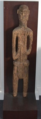 Lot 3265 - A 19th Century Carved Wood Ancestor Figure, standing wearing a loin cloth, his hands raised to...