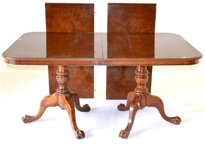 Lot 1003 - A Reproduction Burr Walnut Twin-Pedestal Extending Dining Table of recent date, with two...