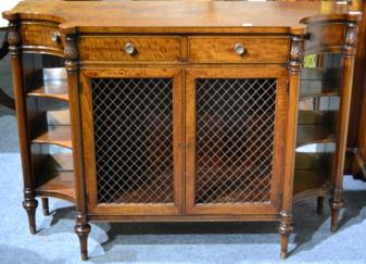 Lot 1004 - A Regency Style Credenza of recent date, with four frieze drawers above brass grille doors...