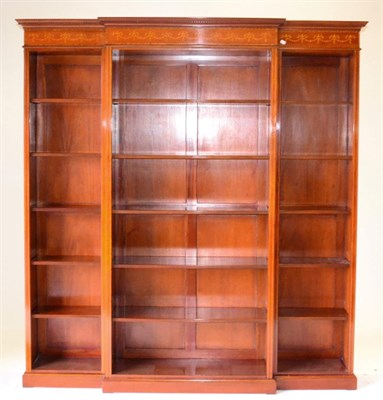 Lot 1005 - A Reproduction Mahogany and Marquetry Inlaid Breakfront Bookcase of recent date, with dentil...